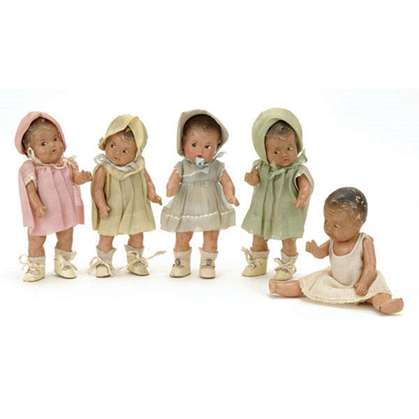 The Dionne Quintuplets were worldwide celebrities. These Madame Alexander dolls show the quints as toddlers. The five dolls, each 7 1/2 inches tall, were sold as a set.